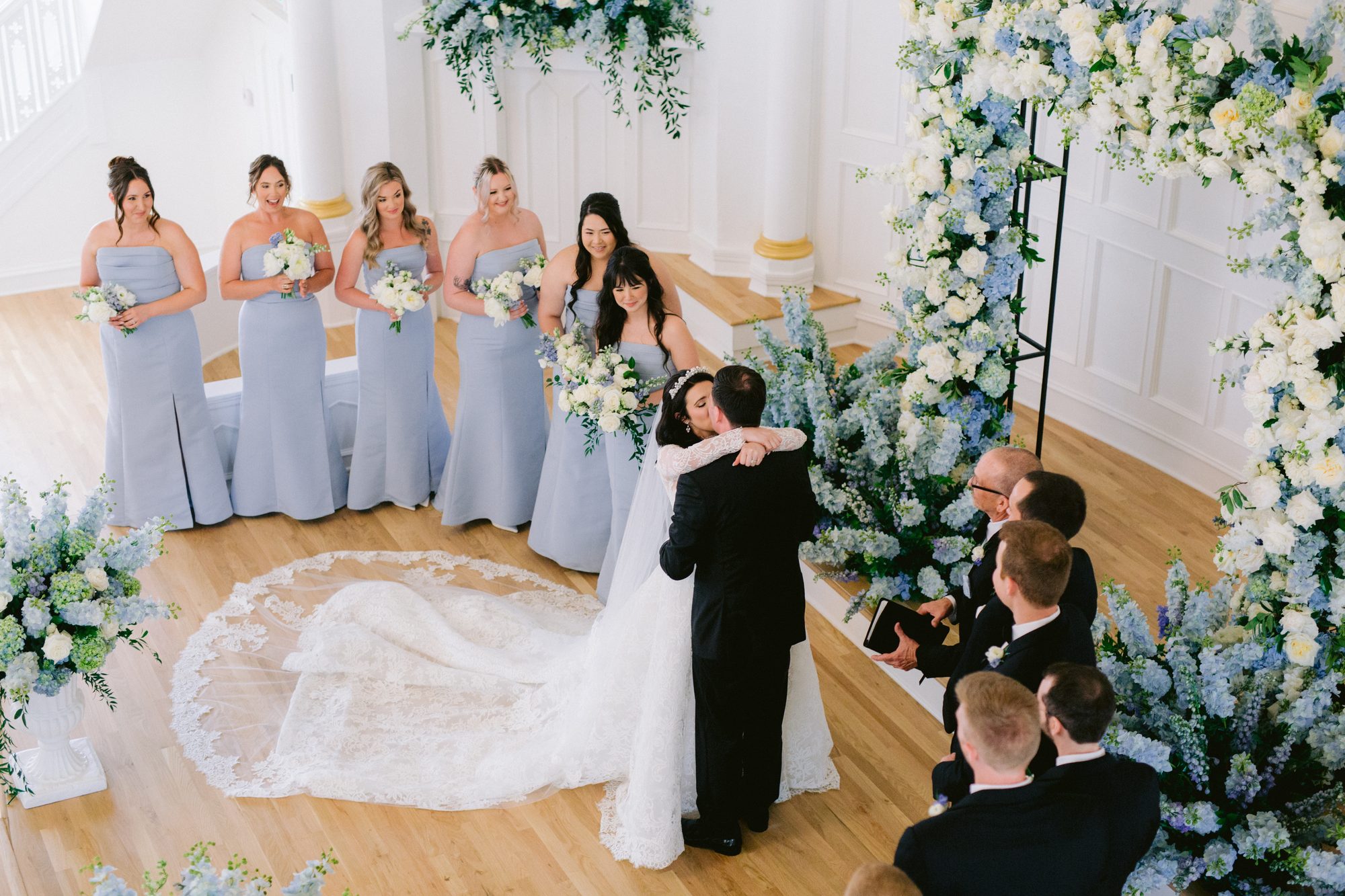 Ceremony florals framing the altar at Melrose Abbey